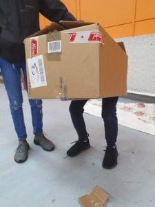 kids at play with cardboard box
